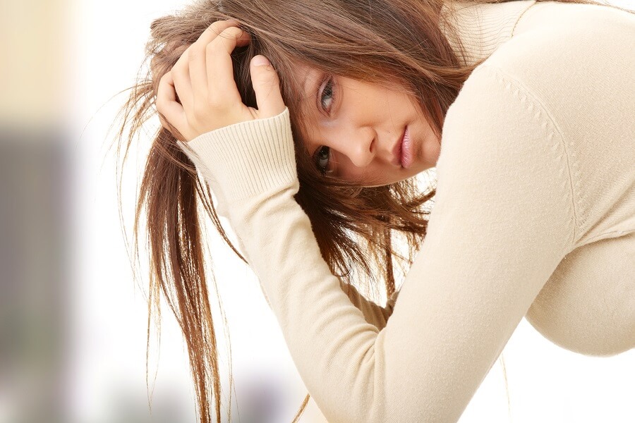 Crying teen girl looking at camera