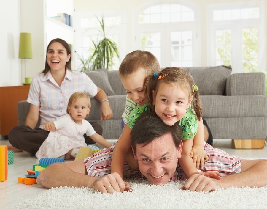 Happy family playing at home