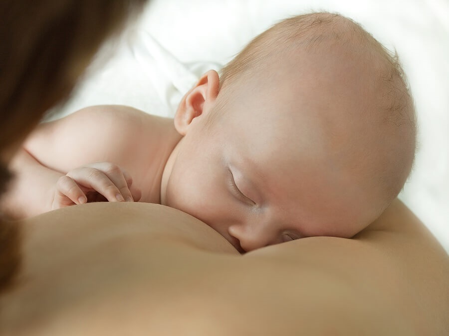 Woman breastfeeding baby