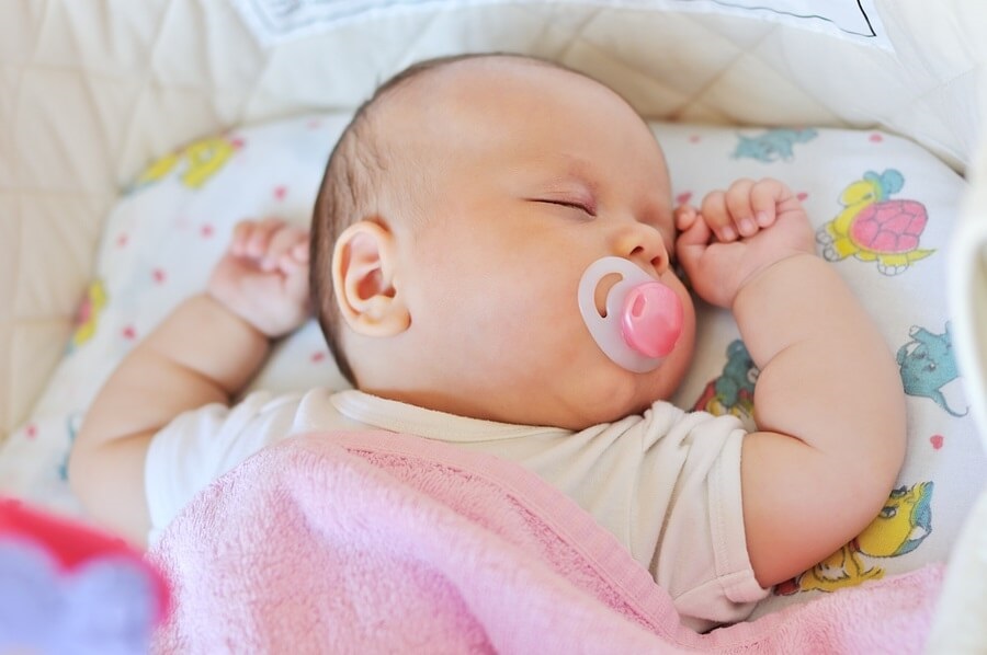 Sleeping baby with pacifier