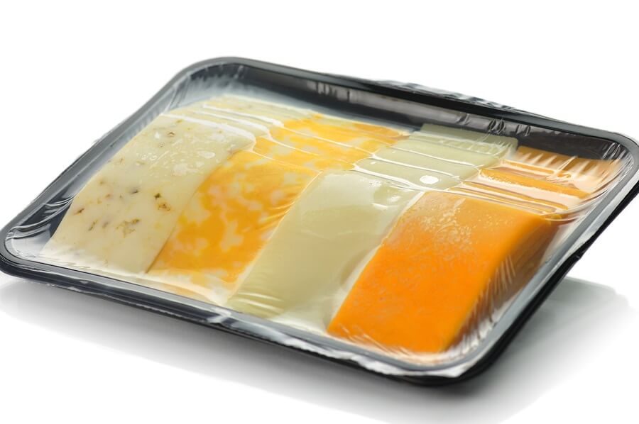 Plastic wrapped sliced cheese tray