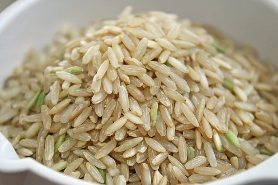 Bowl of brown rice in white bowl