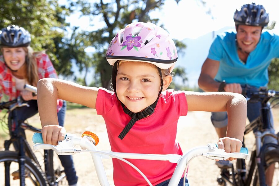 Family wearing bike helmets