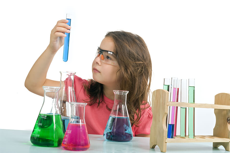 Halloween candy leftovers, girl doing science experiment