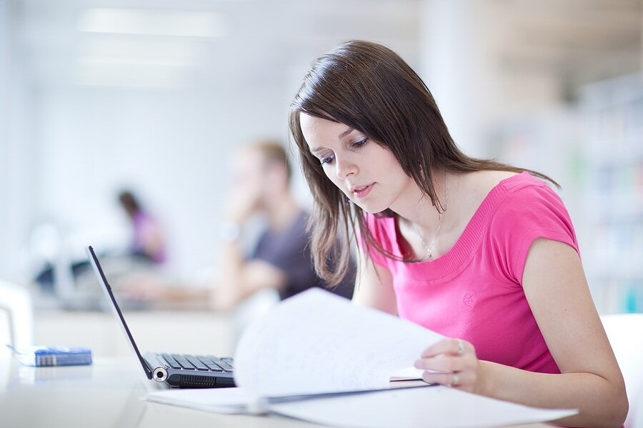 Group of students studying in library