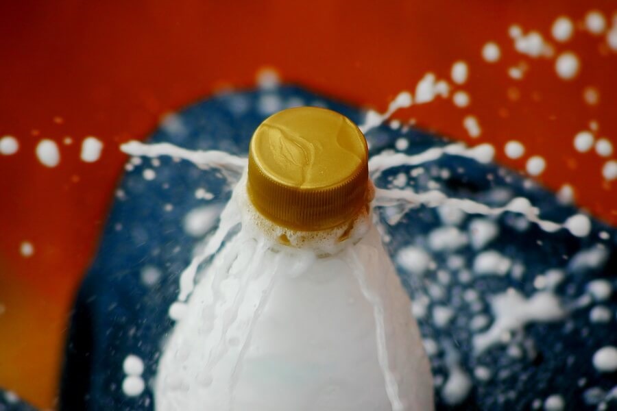 Bottle of soda fizzing and about to explode