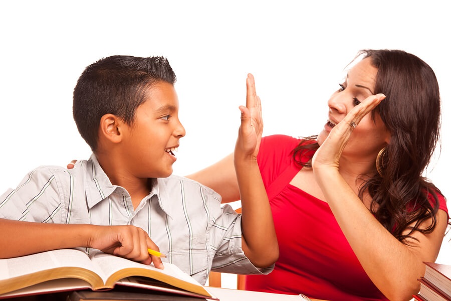 boy and mom high five