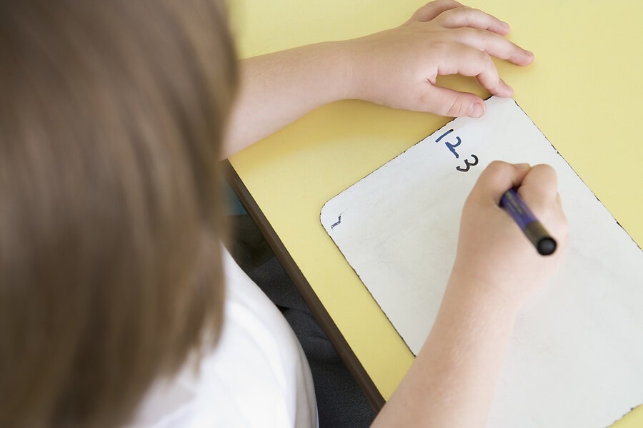 Young girl making a countdown to the end of school