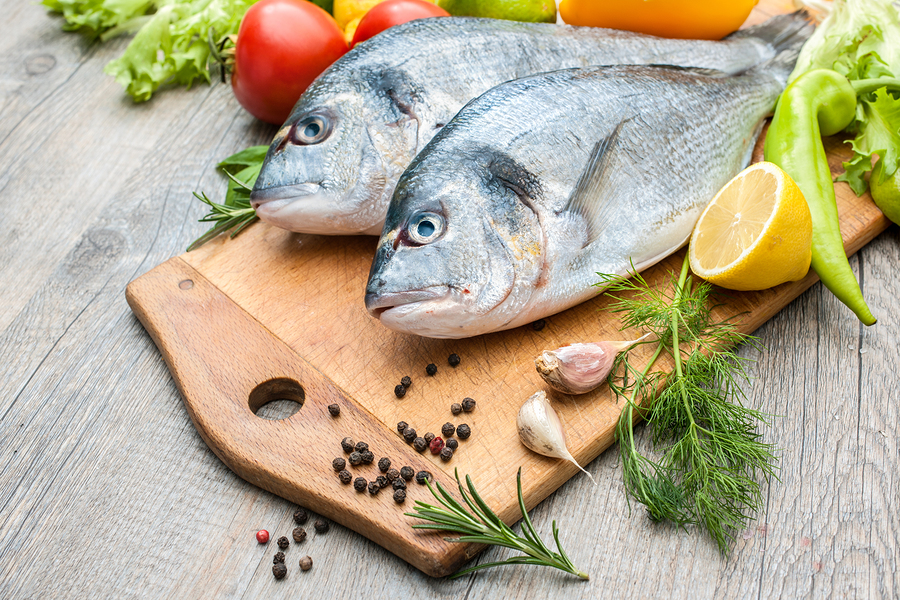 whole fish on cutting board