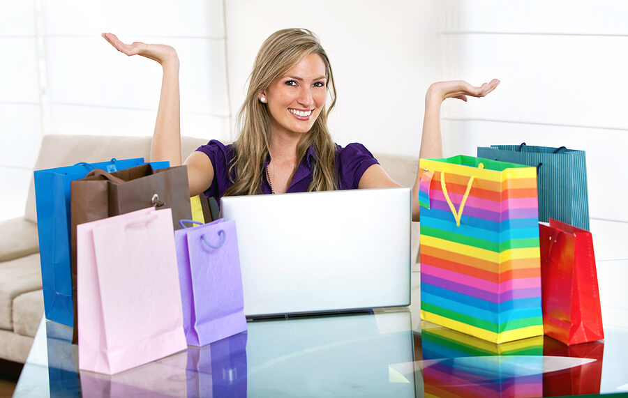 Woman standing among shoppingbags