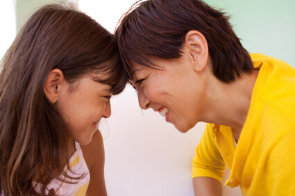 Asian,Motheranddaughtersmilingateachother