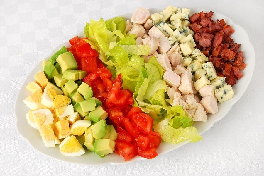 Prepared cobb salad on white background